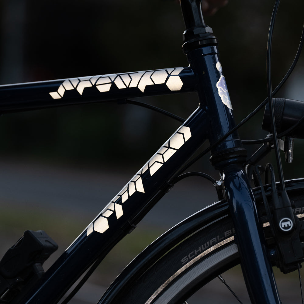black bicycle with reflective stickers