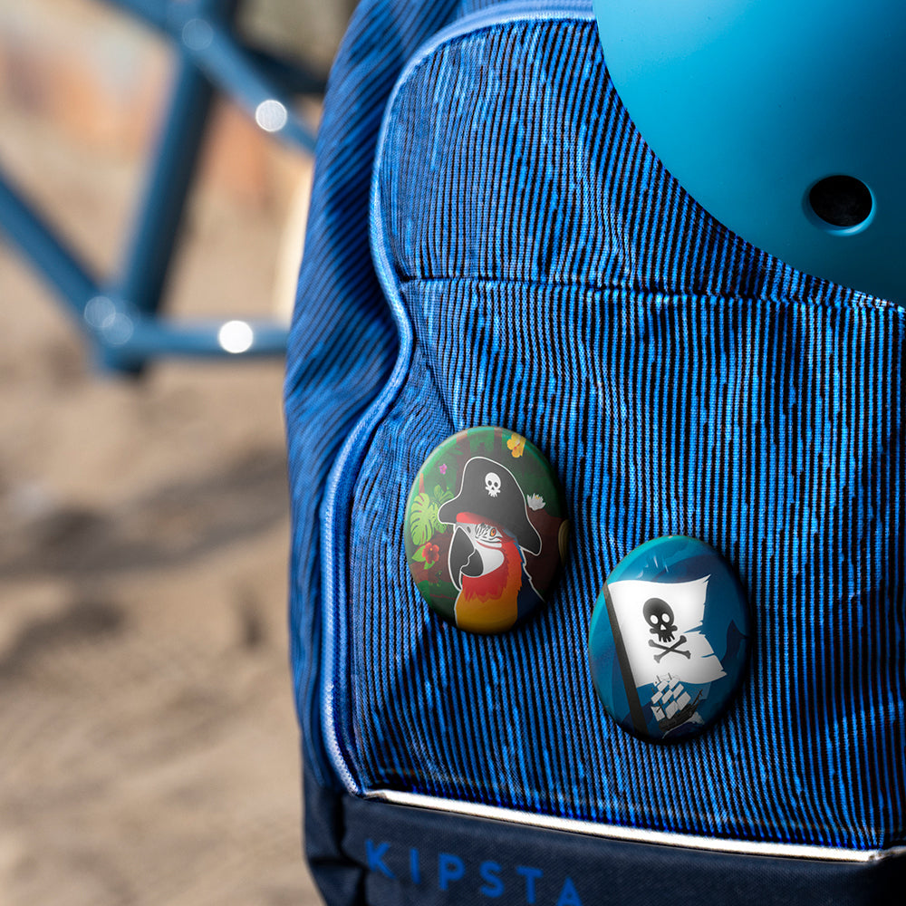 Pirate button , blue backpack and blurry background