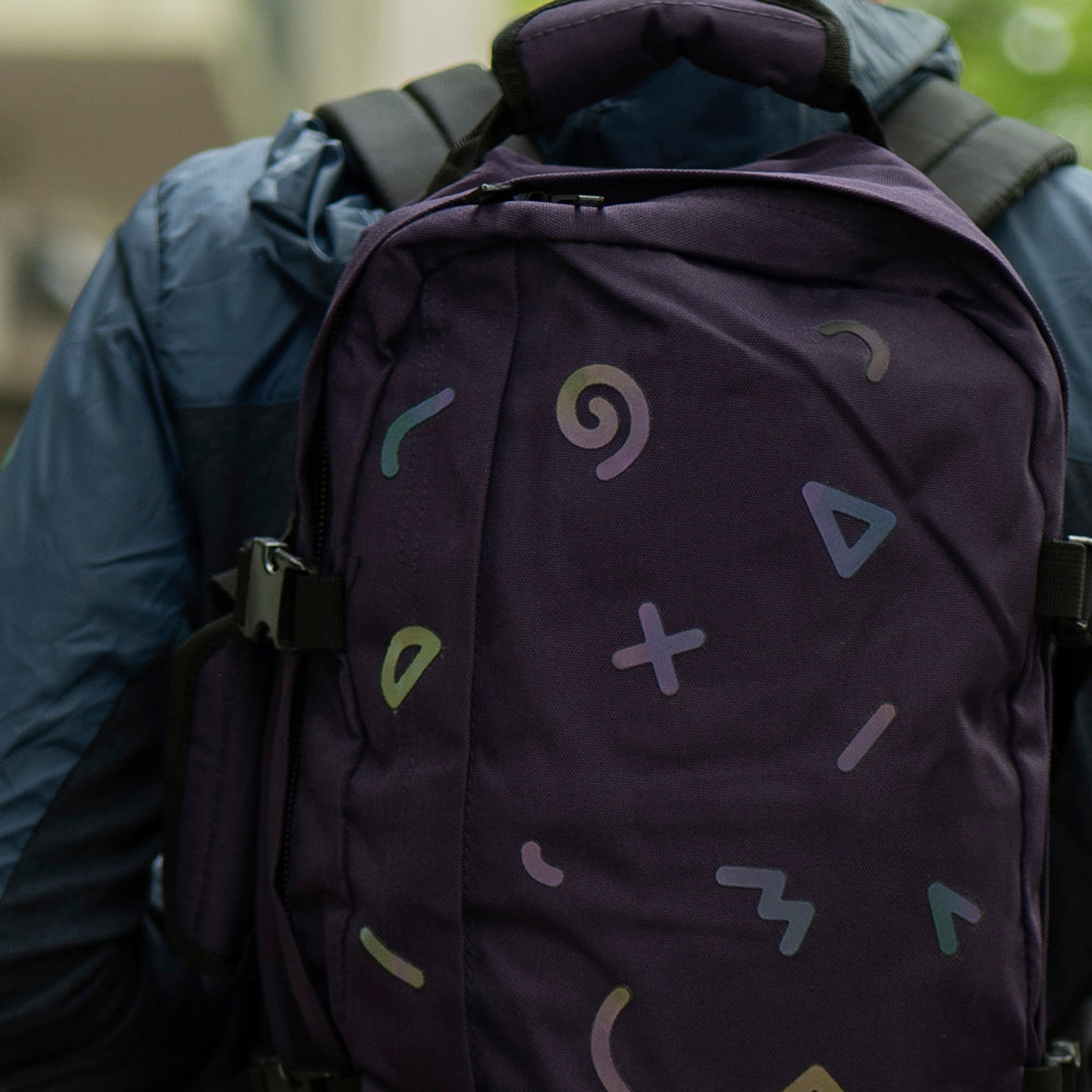 close up of reflective stickers on backpack