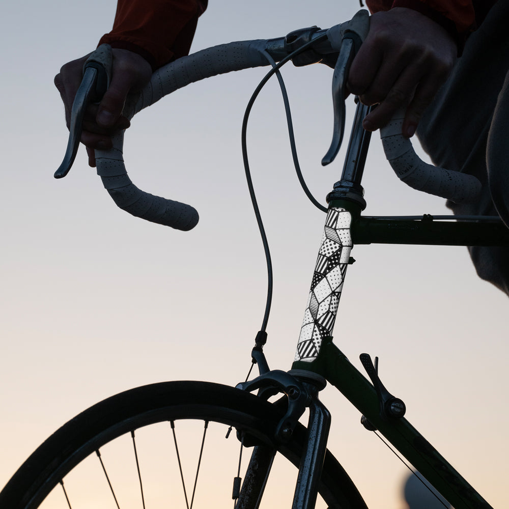 Bicycle with reflective stickers and sky in background